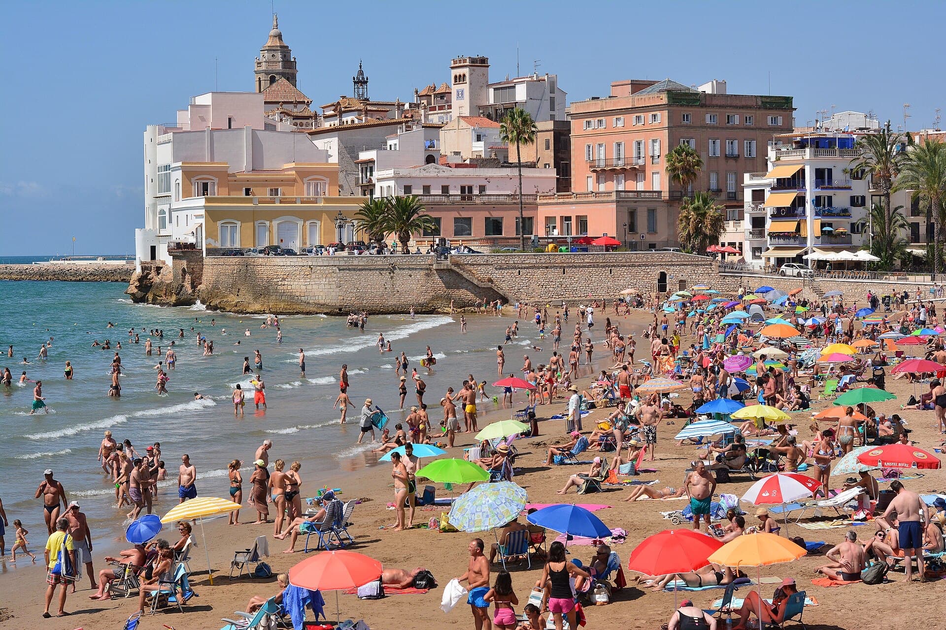 The beach and church of Sitges on a sunny day